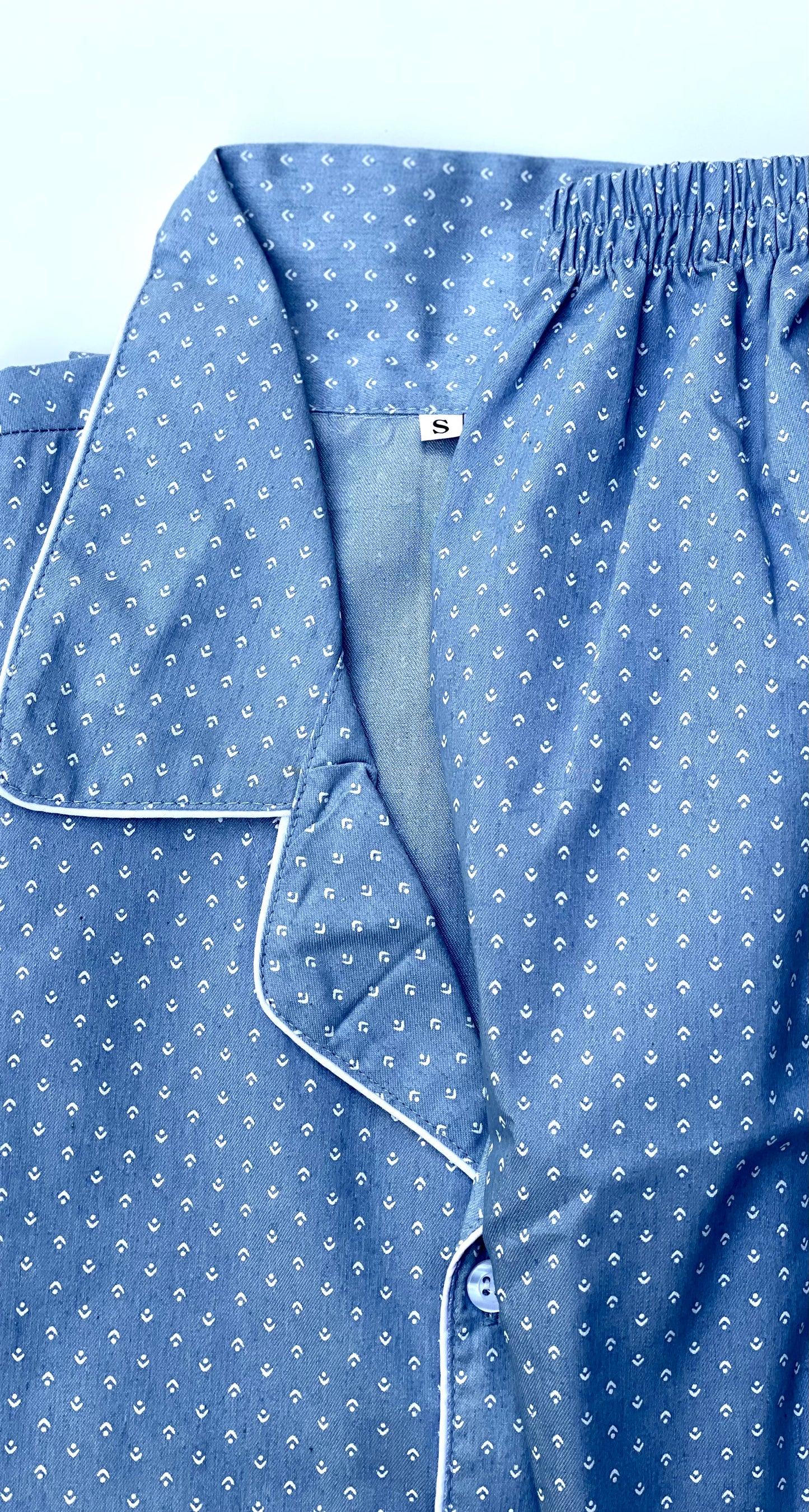 Closeup view of babyblue cotton pajamas for adults, short sleeves and S size