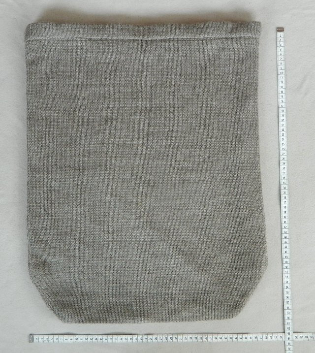 Lying flat TED MOON Foot sack, Grey colour, 50cm width 60cm length and 470g. Handmade foot bag from 100% New Zealand wool and 100% recycled fleece lining.