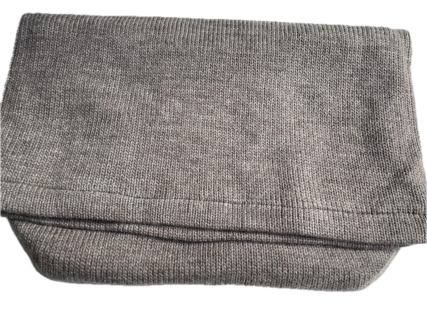 Folded thermal foot bag or footsack made from 100% wool, lined with recycle fleece. Weight 470 g, 50cm W and 60cm L. Each foot sack helps to recycle 5x 1L plastic bottles.