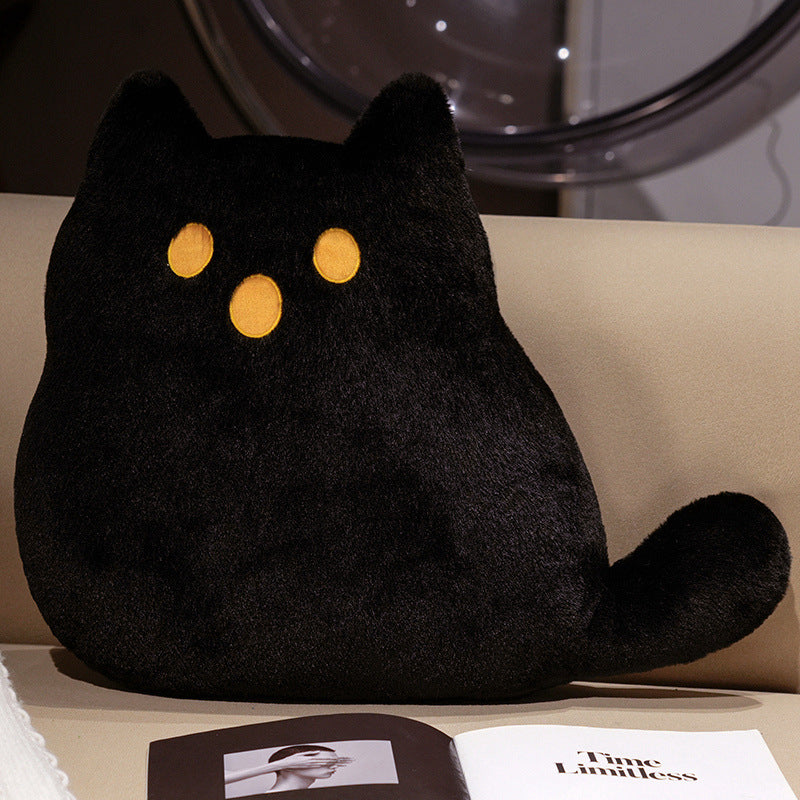 A black plush cat-shaped pillow with yellow embroidered eyes 