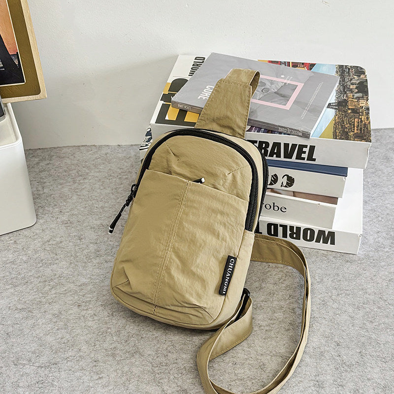 Adjust the shoulder strap to your preferred length and wear across the chest, shoulder or back.