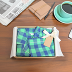Folded Men's and Women's cotton pajama set in gift-style presentation.