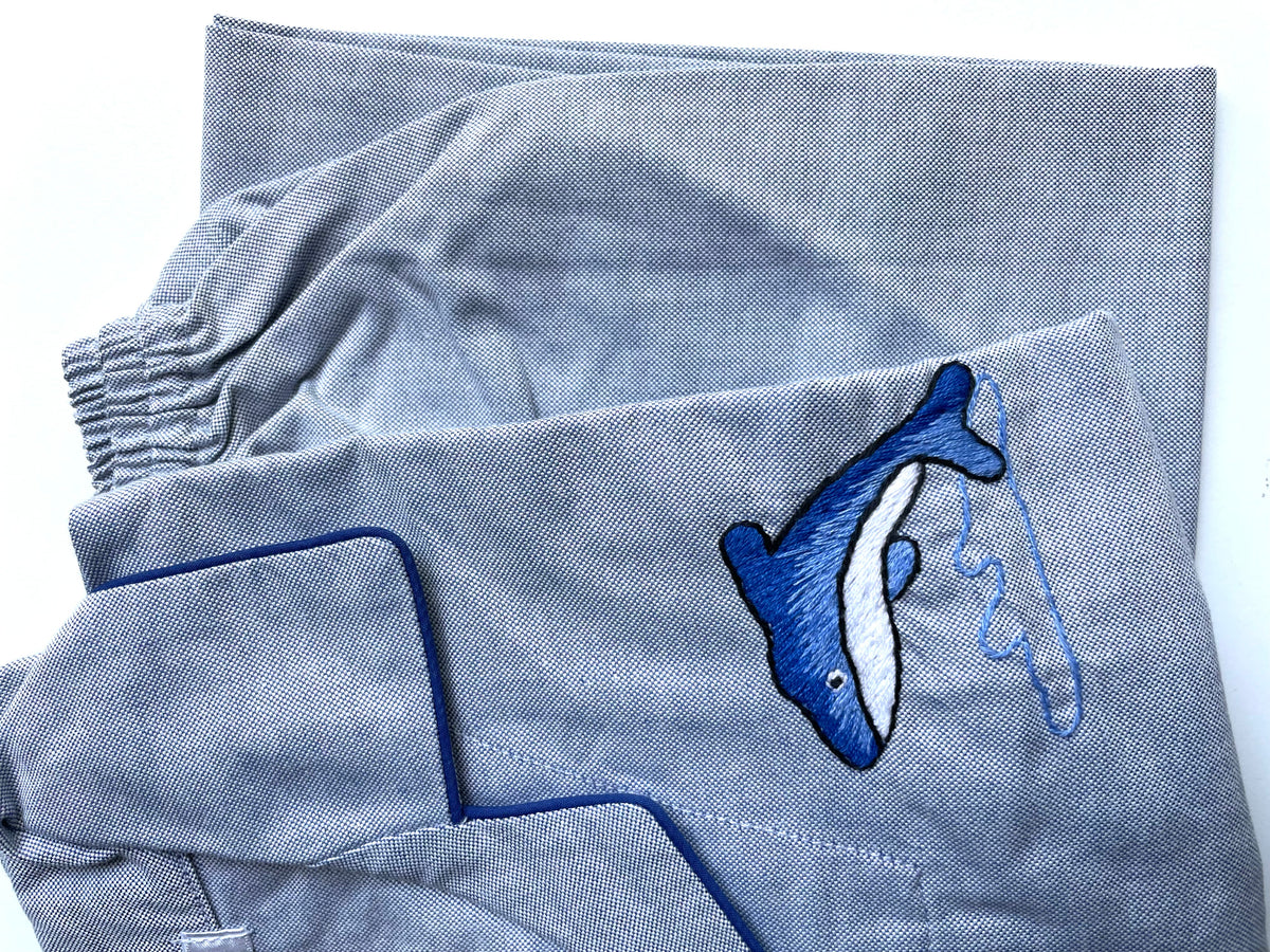 closeup view of the cotton pajama set for boys and girls who love sea dolphins