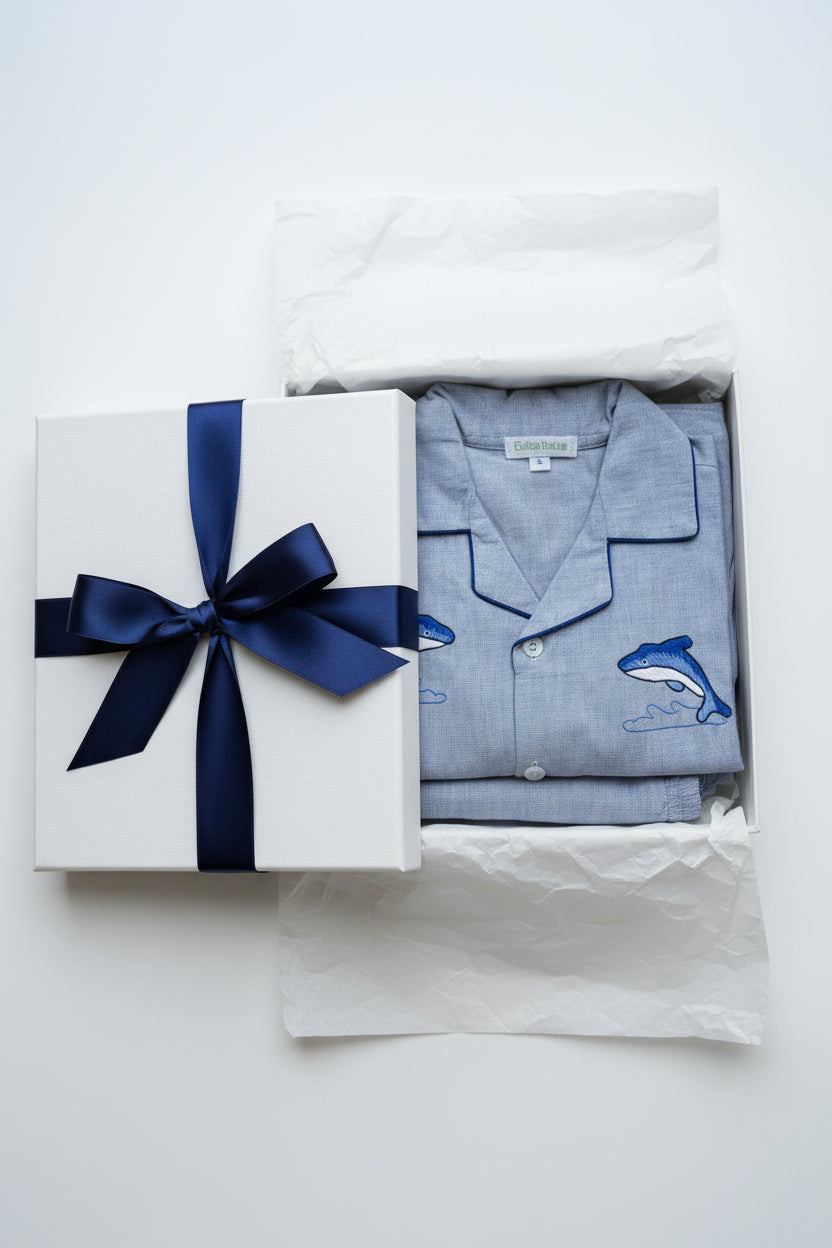 Folded Pajama Set long sleeves with blue little dolphins in a gift box.