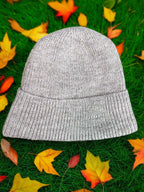 Hand-made knitted wool beanie with recycled fleece lining for comfort and warmth while reducing waste and protecting environment