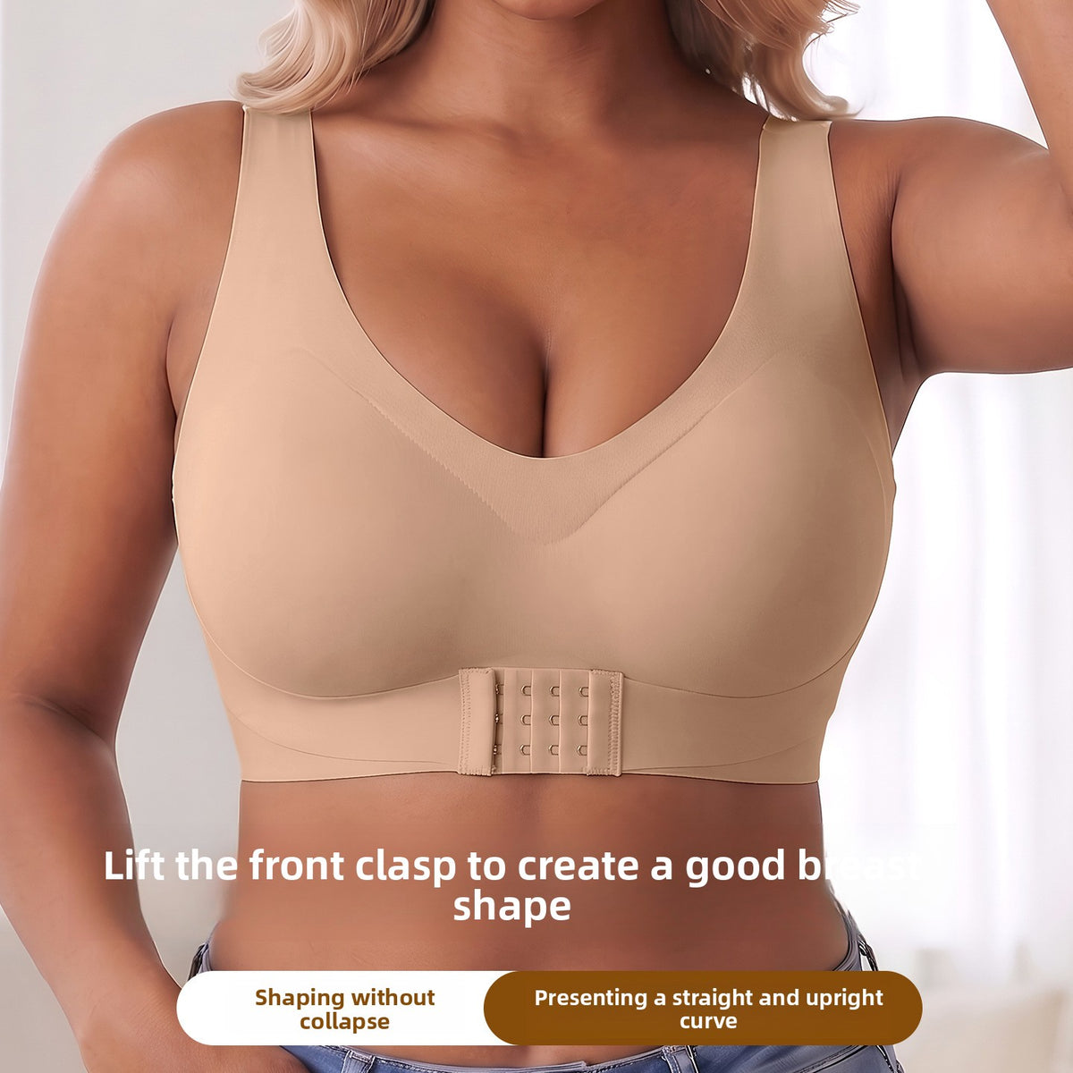 A woman wearing a beige wireless bra with a built-in shaper band and front clasp