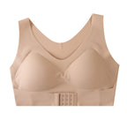 A beige wireless bra with a wide underband and a central hook-and-eye closure, shown against a plain white background.