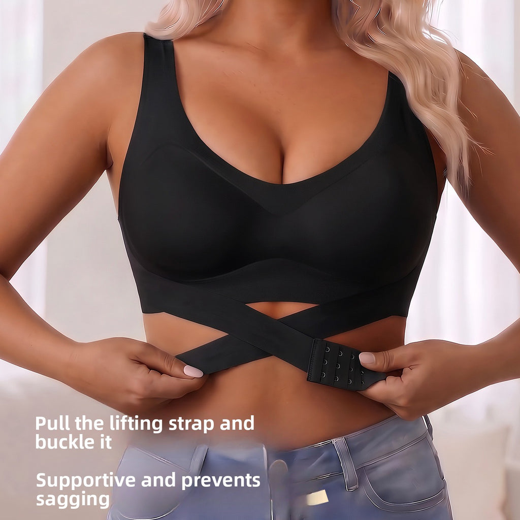 A woman wearing a black supportive bra with a crossover lifting strap and buckle, shown from the chest to the hips with text overlay instructions on how to adjust the strap.