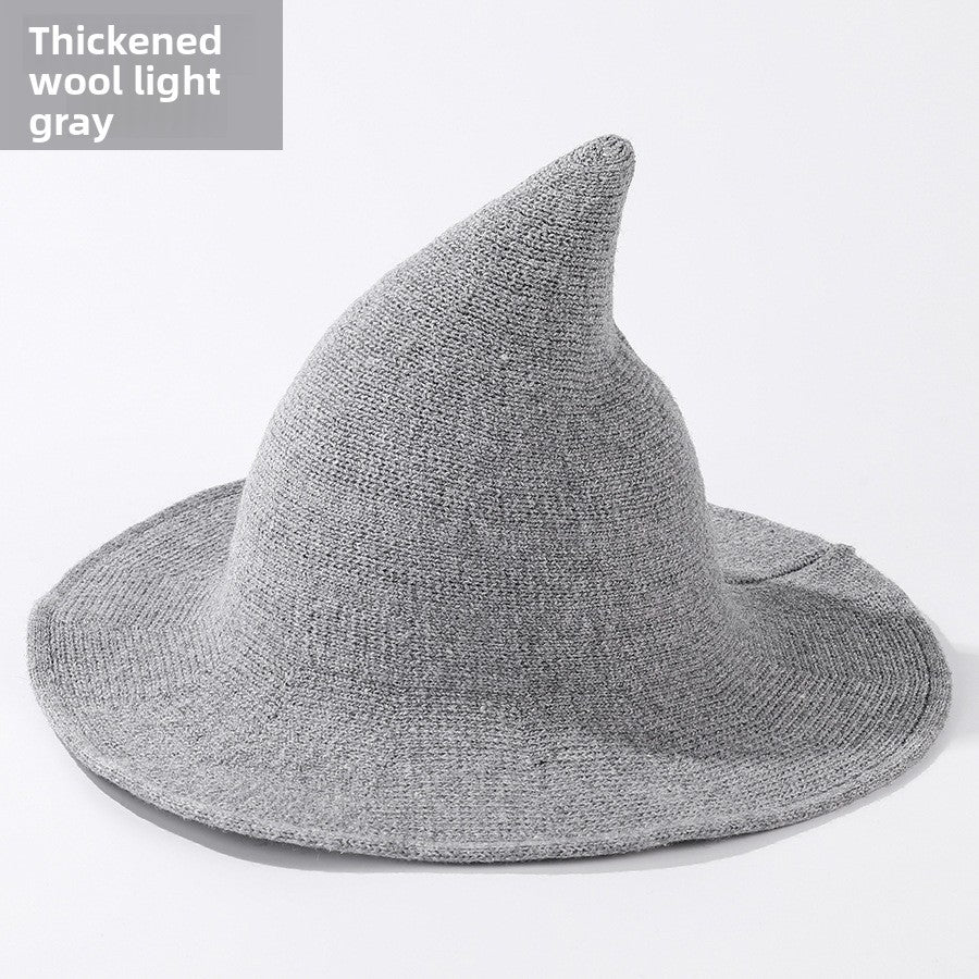 Knitted witch hats for Halloween in light gray colour