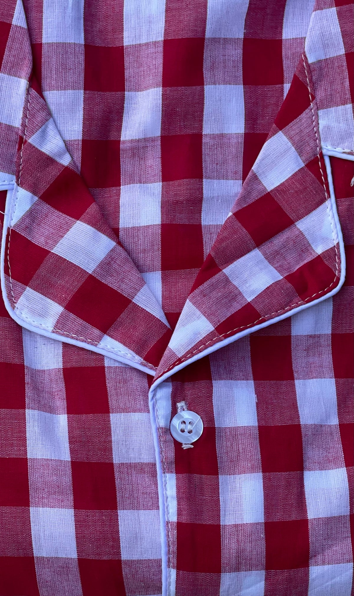 Close-up of cotton fabric for this red white pajama set for men or women