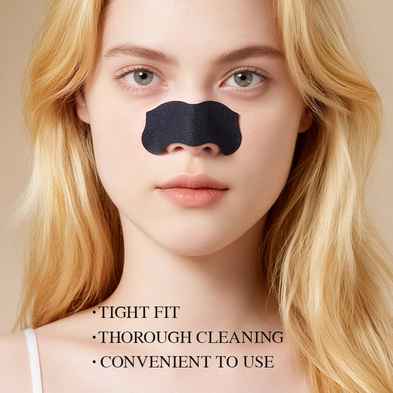 Woman is wearing nose pore strips to help lifting surface buildup and visible blackheads