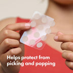 Person holding a pack of round stickers with text 'Helps protect from picking and popping' on a red background.