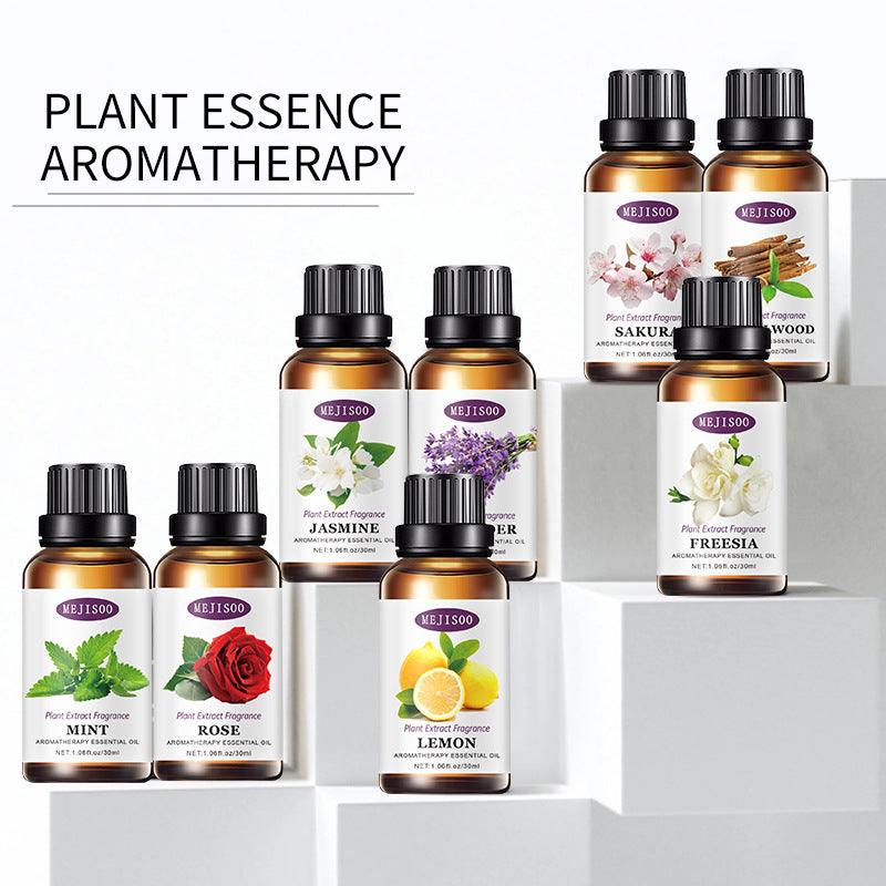 Collection of plant essence aromatherapy bottles on a white background