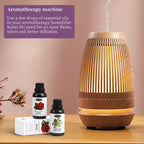 Aromatherapy machine with essential oil bottles on a wooden surface