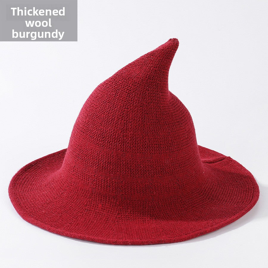 Knitted witch hats for Halloween in red colour