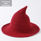 Knitted witch hats for Halloween in red colour