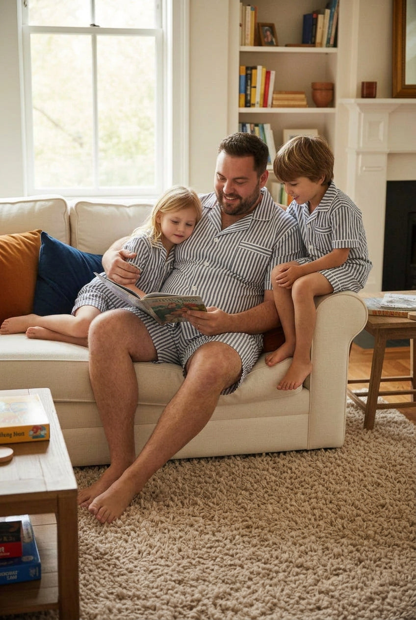 men or women wearing a royal blue cotton pajamas short set relaxing with their children.