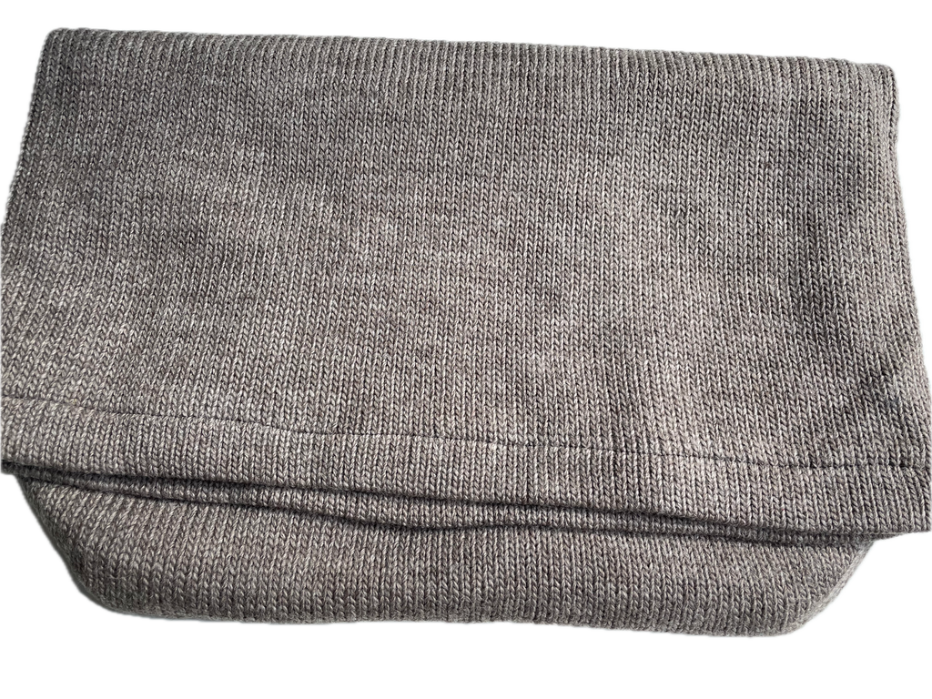 Folded thermal foot bag or footsack made from 100% wool, lined with recycle fleece.  Weight 470 g, 50cm W and 60cm L.  Each foot sack helps to recycle 5x 1L plastic bottles.