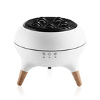 White and black humidifier with wooden legs on a white background