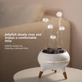White jellyfish tank with glowing jellyfish on a neutral background