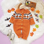 A baby one-piece knit jumpsuit in orangeand matching baby shoes