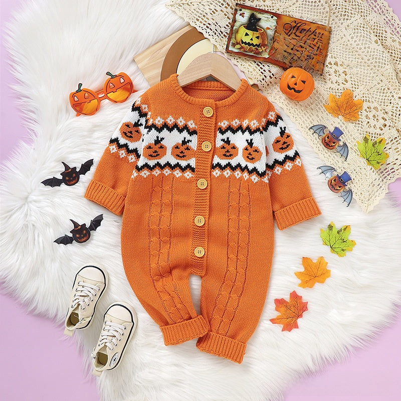 A baby one-piece knit jumpsuit in orangeand matching baby shoes