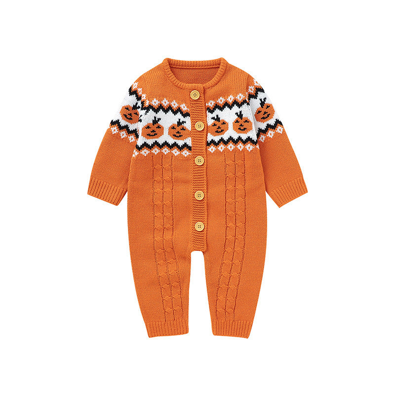 An orange knit baby cardigan romper with a Fair Isle style pattern featuring jack-o'-lanterns on the chest, gold buttons, and cable-knit leg panels, shown on a plain white background.